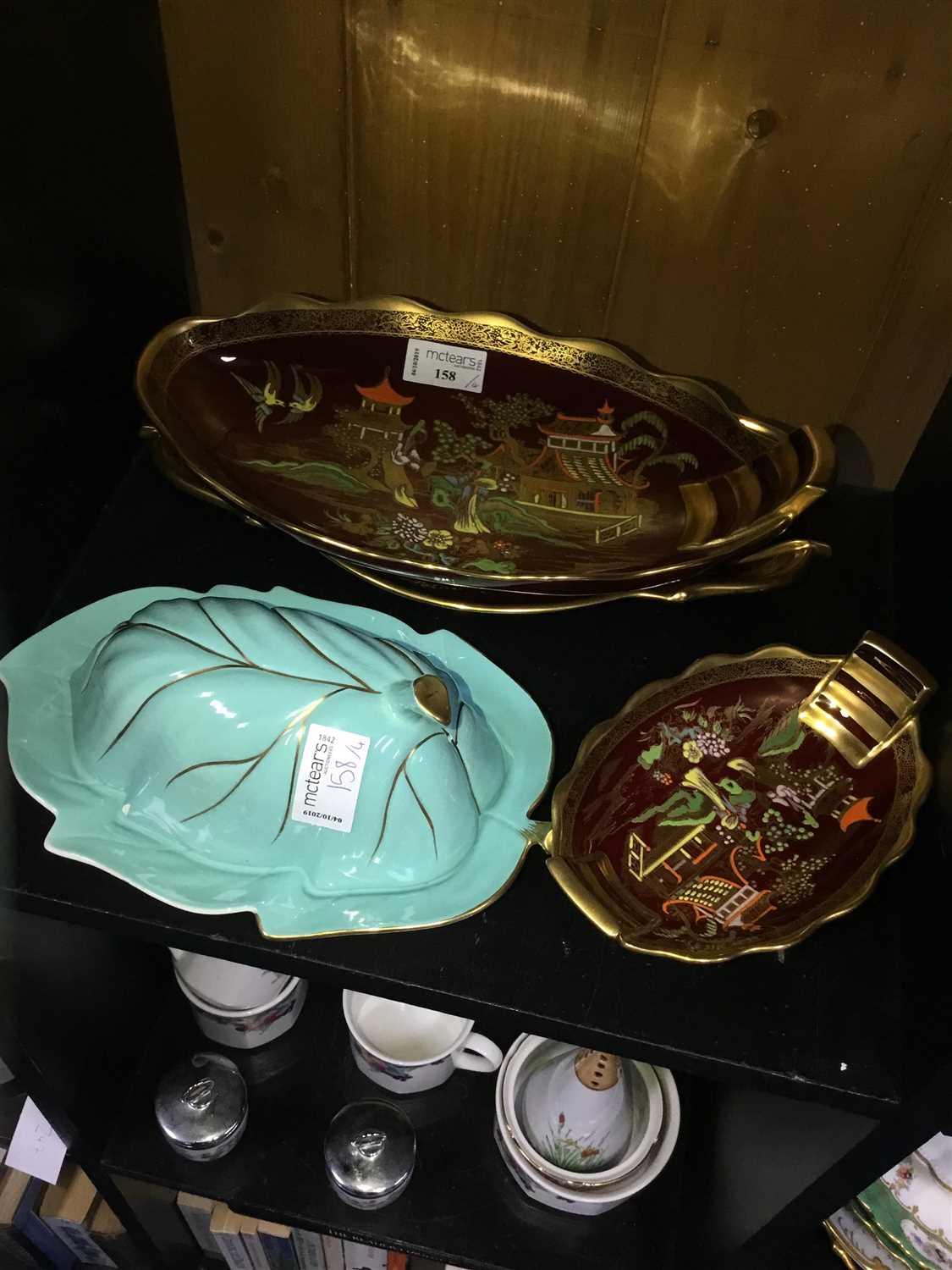 Lot 158 - A LOT OF THREE CARLTON WARE ROUGE ROYAL CHINOISERIE DESIGN DISHES AND A BUTTER DISH