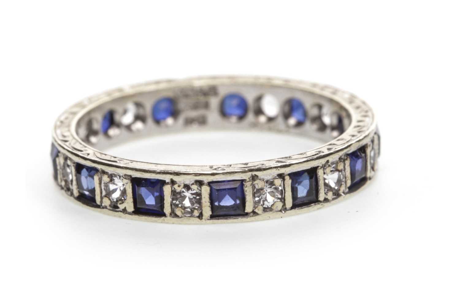 Lot 29 - A BLUE AND WHITE GEM SET BAND