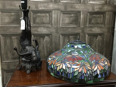 Lot 377 - A FIGURAL LAMP BASE AND A TIFFANY STYLE GLASS SHADE