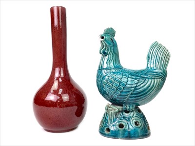 Lot 1040 - A CHINESE BLUE GLAZED COCKEREL AND A SANG DE BOEUF VASE