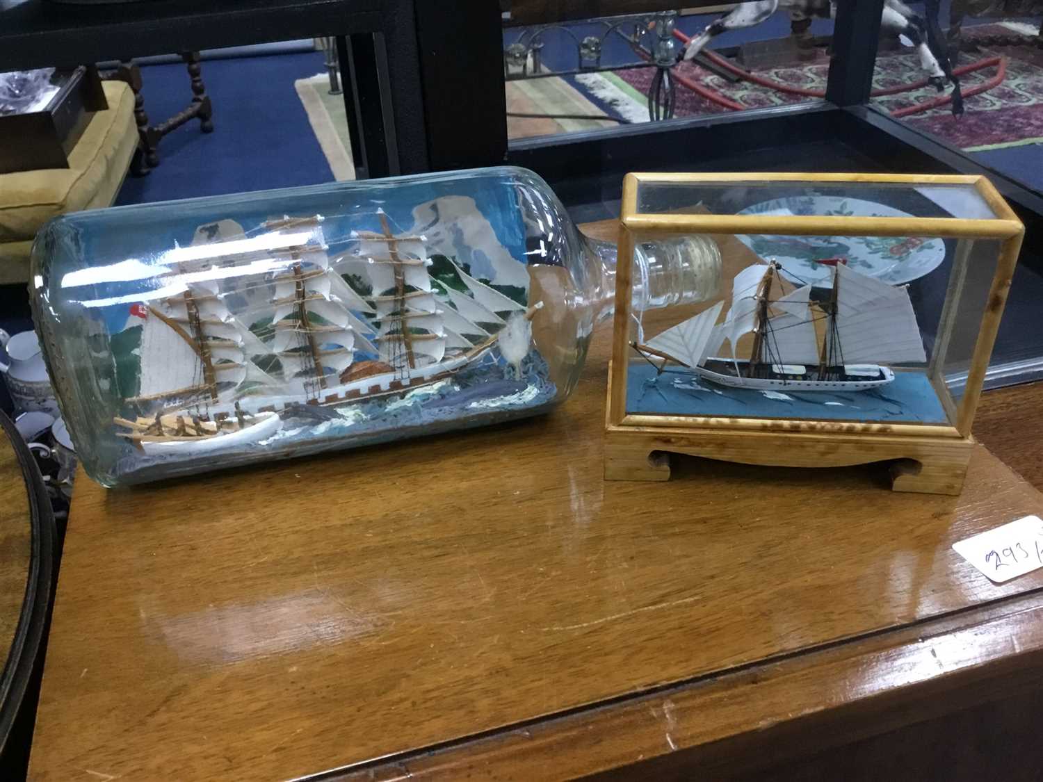 Lot 445 - A SHIP IN A BOTTLE ALONG WITH ANOTHER MODEL SHIP AND OTHER ITEMS