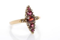 Lot 20 - MARQUISE SHAPED GARNET AND DIAMOND RING with...