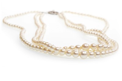 Lot 15 - A THREE STRANDED PEARL NECKLACE