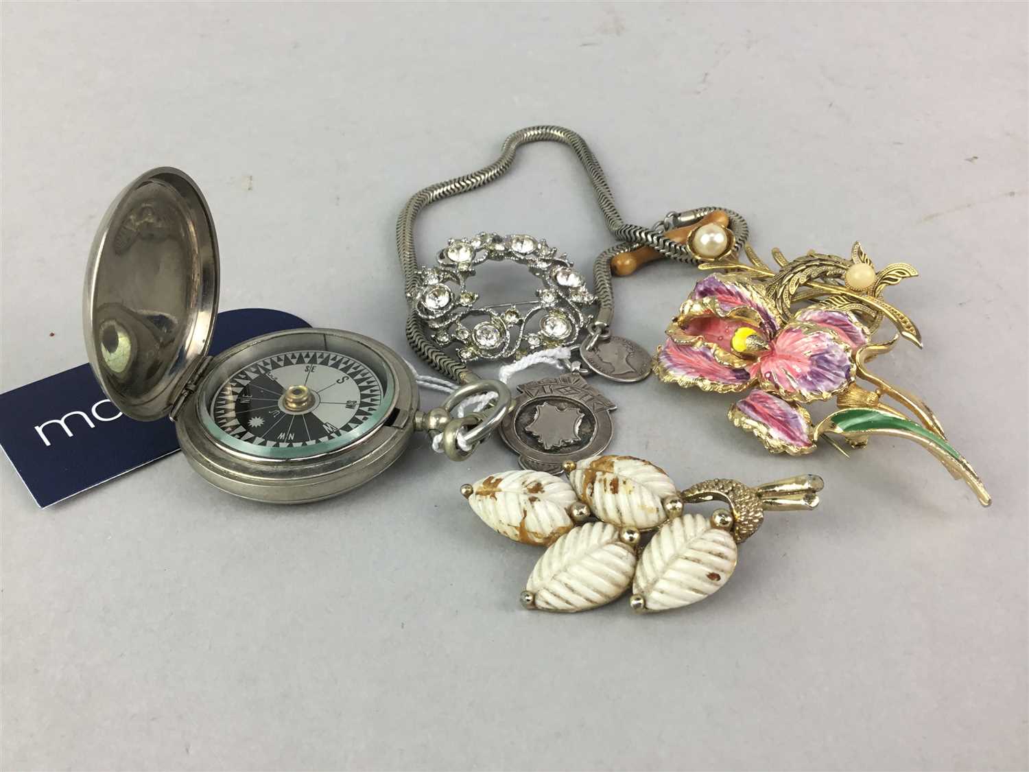 Lot 52 - A MILITARY ISSUE COMPASS AND COSTUME JEWELLERY