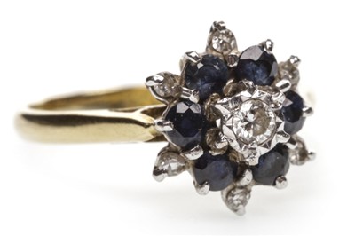 Lot 46 - A BLUE GEM SET AND DIAMOND CLUSTER RING