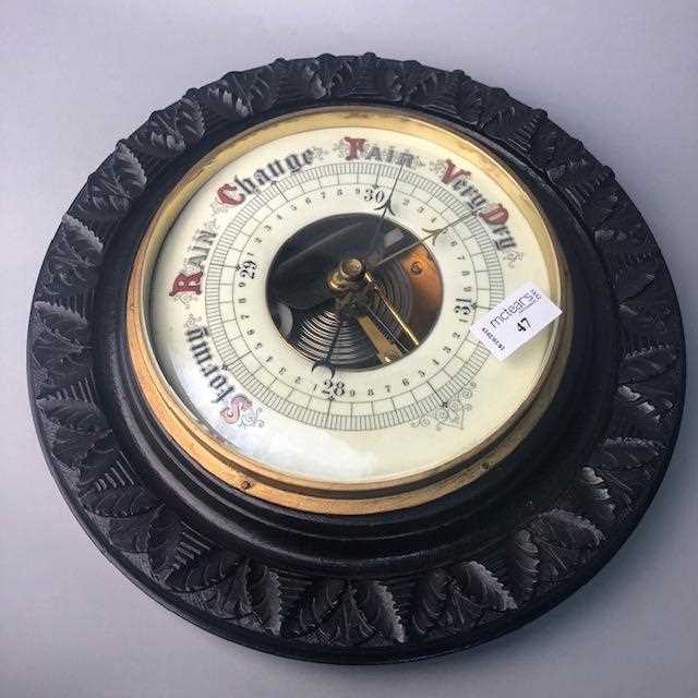 Lot 47 - A CIRCULAR STAINED WOOD WALL BAROMETER