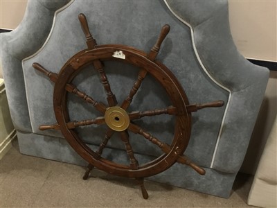 Lot 42 - A SHIP'S WHEEL AND A PICTURE OF A CAPTAIN