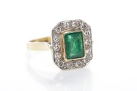Lot 37 - EMERALD AND DIAMOND CLUSTER RING the central...