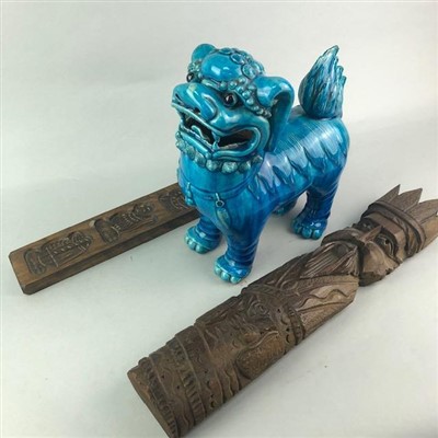 Lot 280 - A CERAMIC FOE DOG AND TWO CARVED WOOD WALL HANGINGS