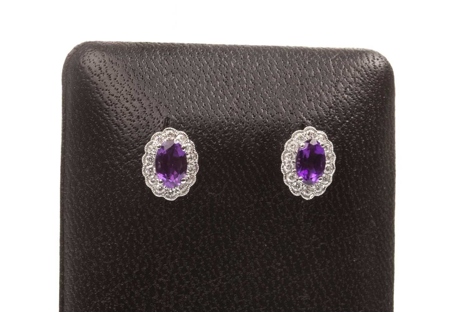 Lot 70 - A PAIR OF AMETHYST AND DIAMOND EARRINGS