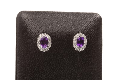 Lot 70 - A PAIR OF AMETHYST AND DIAMOND EARRINGS
