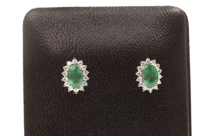 Lot 76 - A PAIR OF EMERALD AND DIAMOND EARRINGS