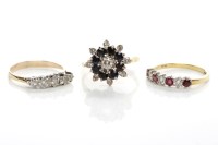 Lot 63 - GROUP OF THREE DIAMOND RINGS comprising a ruby...