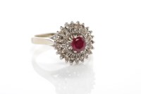 Lot 74 - RUBY AND DIAMOND CLUSTER RING the high set...