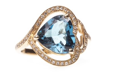 Lot 141 - A TOPAZ AND DIAMOND RING