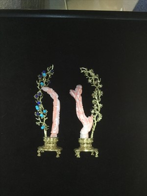 Lot 1031 - A PAIR OF CHINESE CORAL CARVINGS OF FEMALES