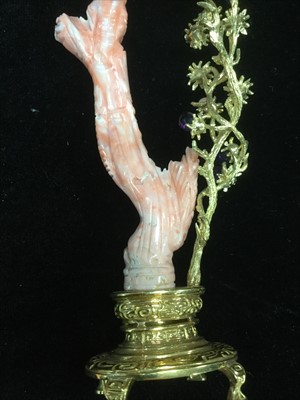Lot 1031 - A PAIR OF CHINESE CORAL CARVINGS OF FEMALES