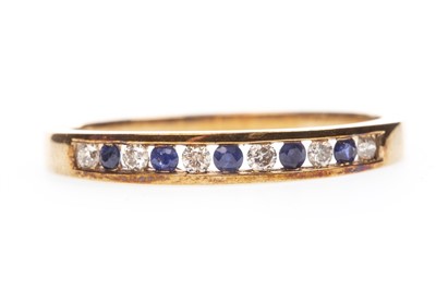 Lot 164 - A BLUE GEM AND DIAMOND RING