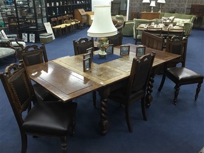Lot 258 - AN EXTENDING DINING TABLE AND SIX CHAIRS