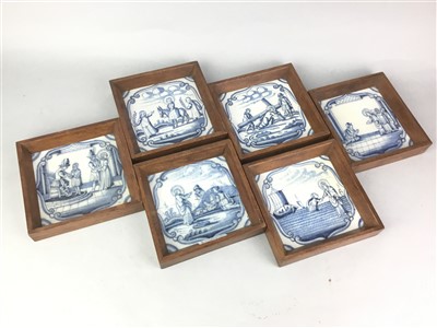 Lot 231 - A SET OF SIX BLUE AND WHITE DELFT TILES IN OAK FRAMES