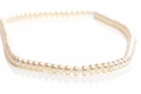Lot 100 - FRESHWATER PEARL NECKLACE the ovoid pearls...
