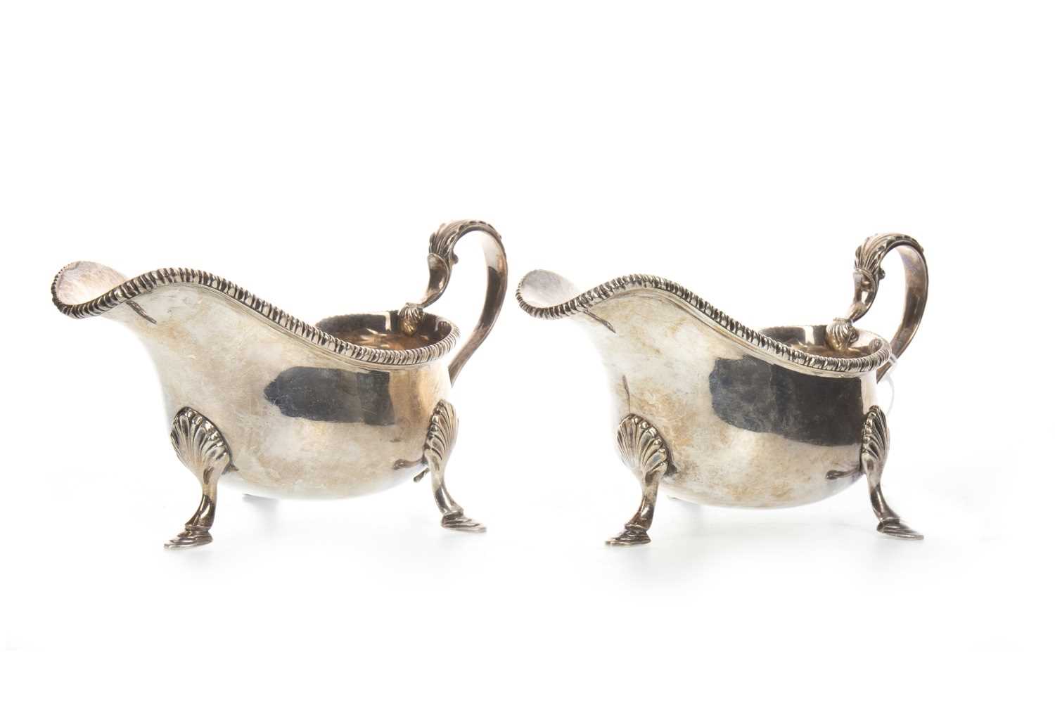 Lot 807 - A PAIR OF GEORGE V SILVER SAUCE BOATS