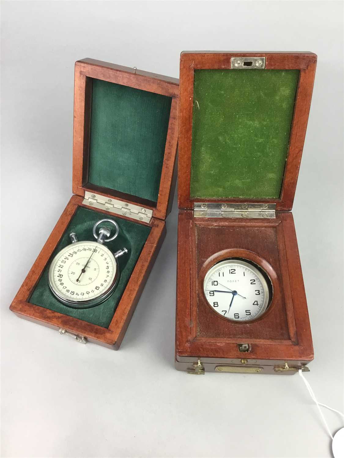 Lot 11 - A RUSSIAN TRAVELLING TIME PIECE AND A STOP WATCH