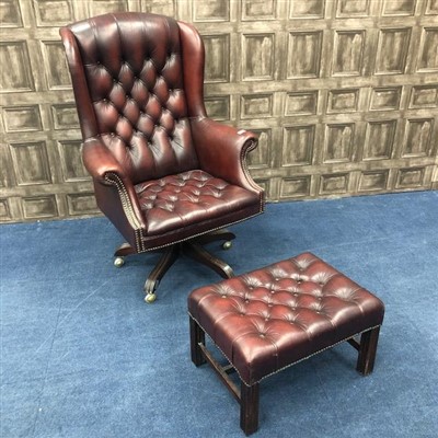 Lot 71 - AN OXBLOOD CHESTERFIELD WING BACK ARMCHAIR AND MATCHING FOOTSTOOL