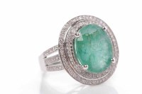 Lot 127 - LARGE EMERALD AND DIAMOND RING the oval...