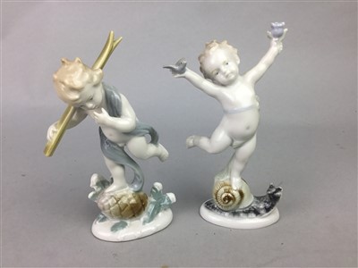 Lot 53 - A STAFFORDSHIRE COFFEE SERVICE ALONG WITH TWO CUPS AND SAUCERS AND A PAIR OF CHERUBS