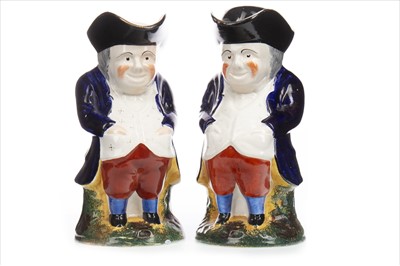Lot 1225 - A PAIR OF 19TH CENTURY STAFFORDSHIRE TOBY JUGS