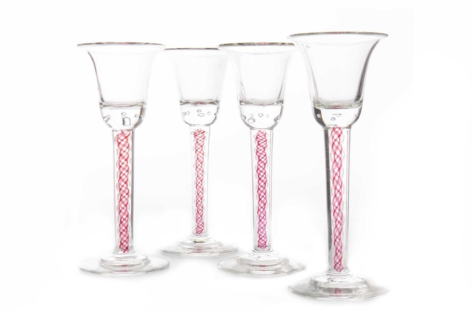 Lot 1227 - A SET OF FOUR 20TH CENTURY WINE GLASSES