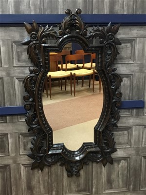 Lot 810 - A BAROQUE STYLE WALL MIRROR