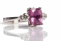 Lot 179 - PINK SAPPHIRE AND DIAMOND THREE STONE RING the...