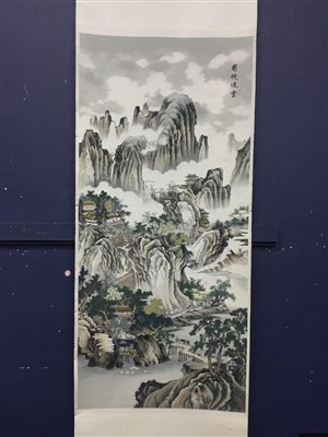 Lot 433 - AN EARLY 20TH CENTURY CHINESE SILK WALL HANGING OF MISTY MOUNTAINS