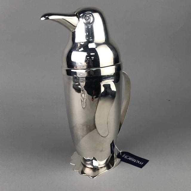 Lot 61 - A WHITE METAL COCKTAIL SHAKER IN THE FORM OF A PENGUIN