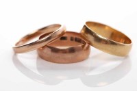 Lot 197 - GROUP OF THREE WEDDING BANDS comprising two...