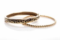 Lot 218 - TWO BANGLES one marked for fourteen carat gold,...
