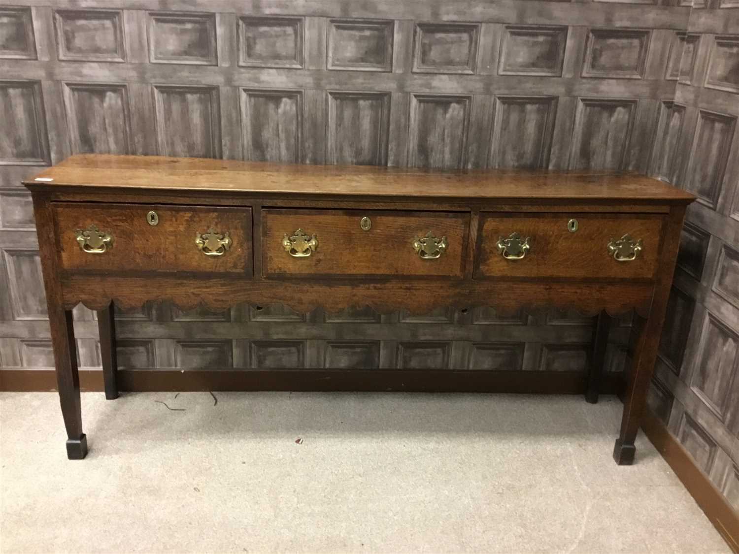 Lot 887 - A MID 18TH CENTURY OAK AND ELM BACKLESS DRESSER