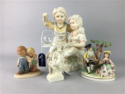 Lot 163 - A PAINTED PLASTER FIGURE GROUP OF A BOY AND GIRL ALONG WITH THREE OTHERS