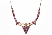 Lot 246 - FOURTEEN CARAT GOLD RUBY AND DIAMOND NECKLET...