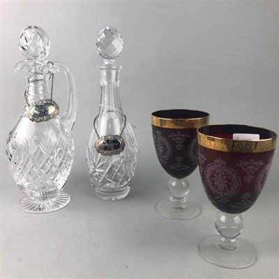 Lot 228 - A PAIR OF RUBY GLASS GOBLETS AND TWO CRYSTAL DECANTERS WITH STOPPERS