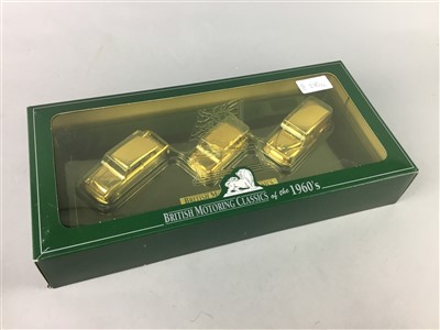 Lot 230 - A REPRODUCTION MUSKET AND A SET OF GOLD PLATED MODEL CARS