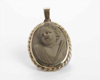 Lot 259 - LAVA CAMEO PENDANT of oval form, in high...