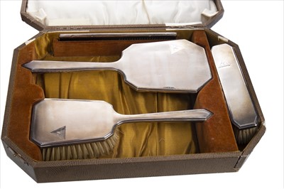 Lot 858 - A SILVER BACKED FOUR PIECE DRESSING TABLE SET IN FITTED CASE