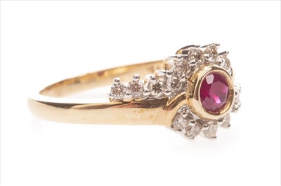 Lot 345 - A RED GEM AND DIAMOND DRESS RING