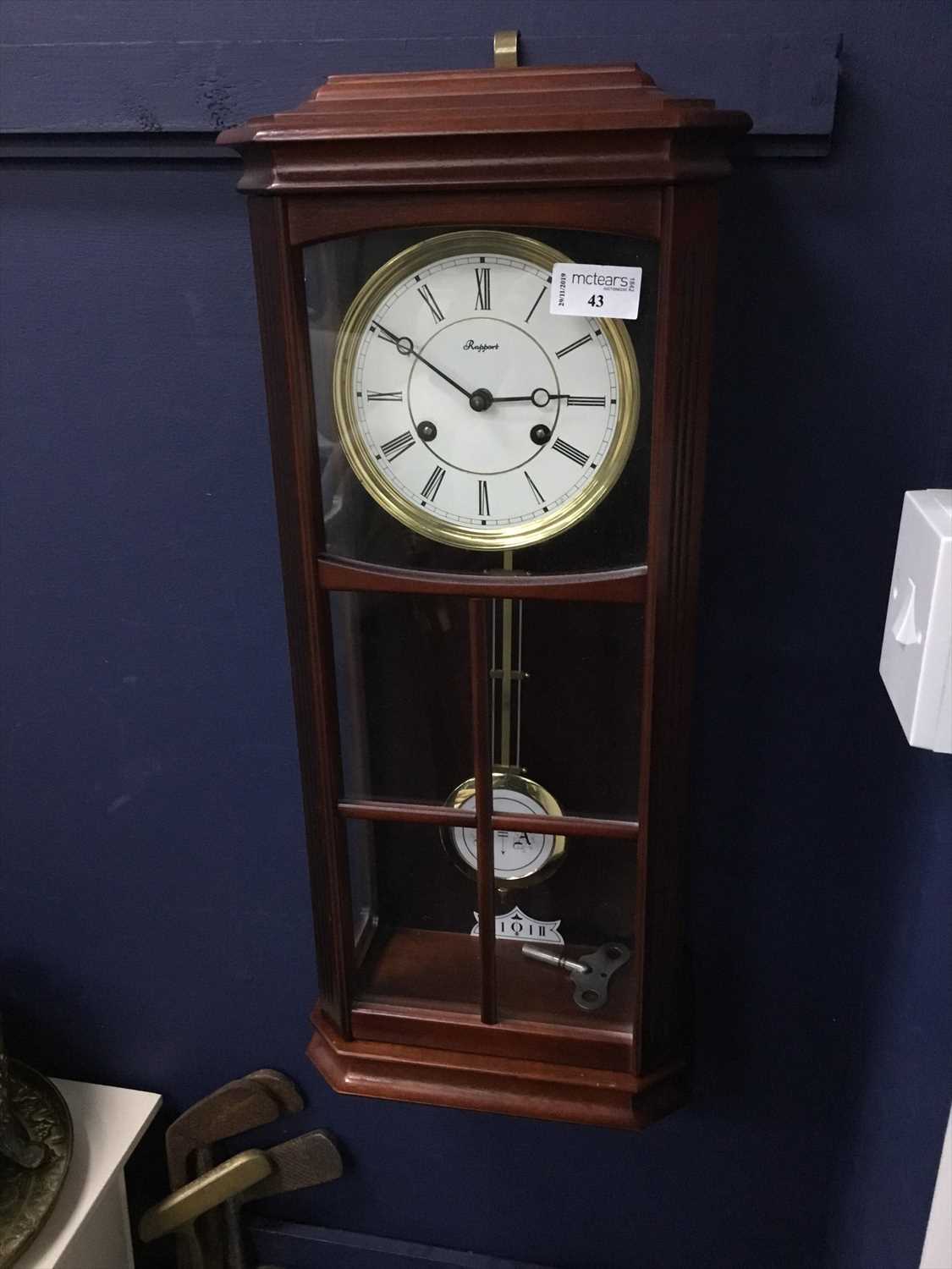 Lot 43 - A STAINED WOOD RAPPORT WALL CLOCK