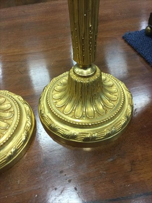 Lot 1631 - A PAIR OF ORMOLU AND ONYX CANDELABRA