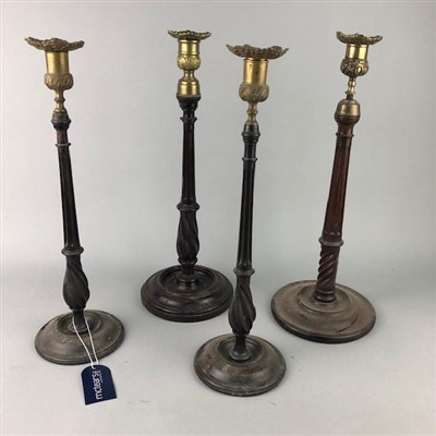Lot 240 - A PAIR OF MAHOGANY AND BRASS MOUNTED CANDLESTICKS AND TWO OTHERS