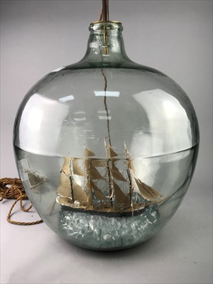 Lot 127 - A GLASS DEMIJOHN WITH MODEL OF A SHIP INSIDE